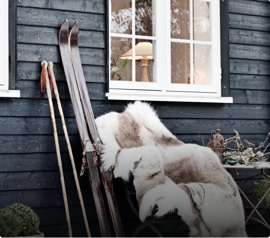Skis and a fluffy coat outside in Vail CO