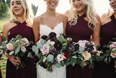 A bride and bridesmaids with bouquets