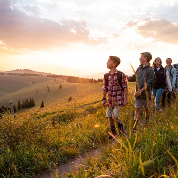 A family hiking a trail in Vail CO