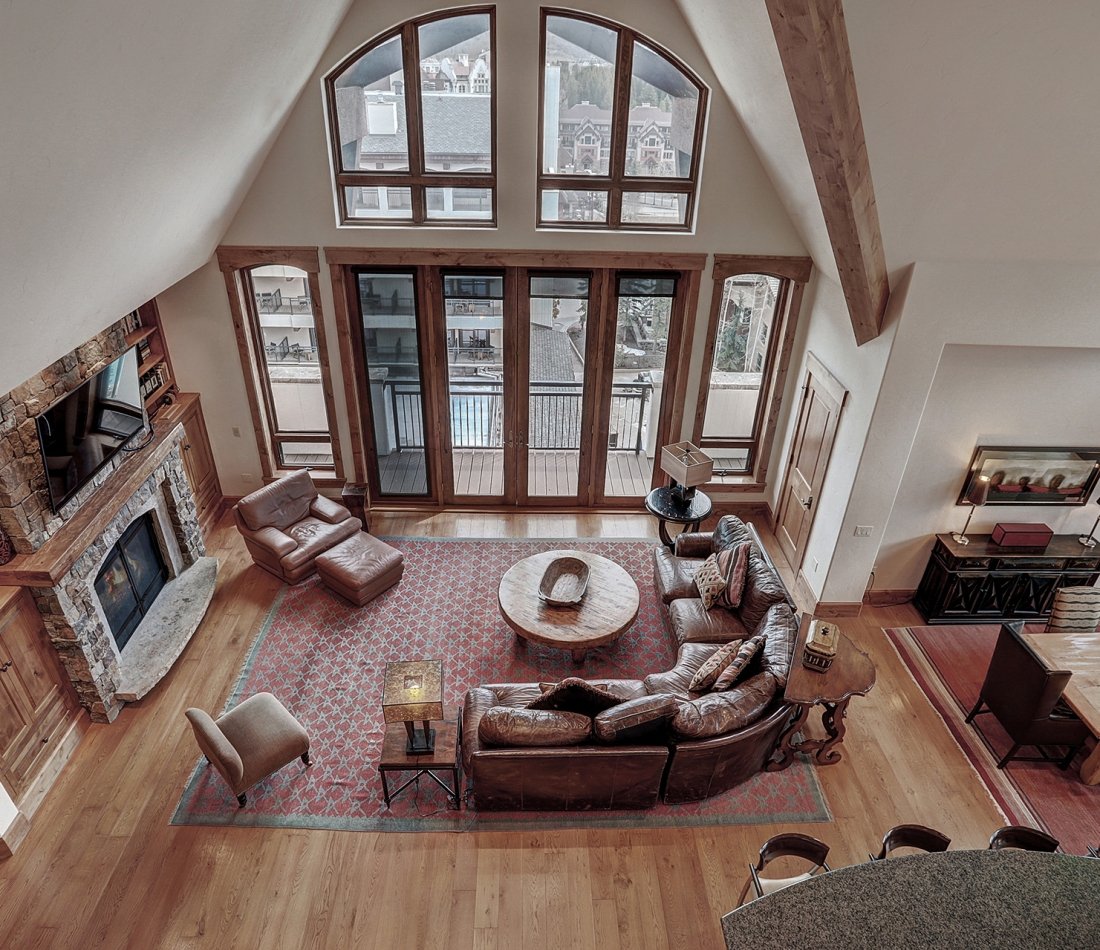 A view of the living room from the loft in the 3 bedroom penthouse suite at The Hythe Vail