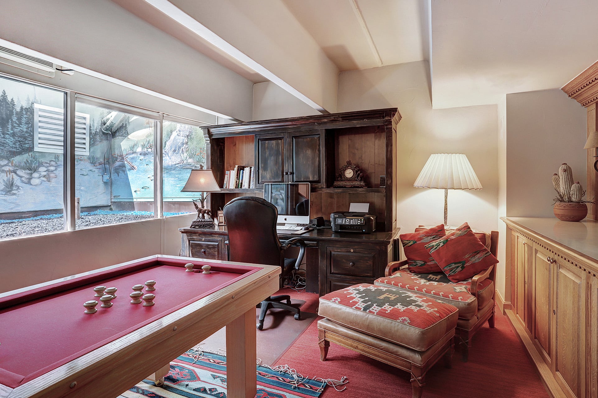 The games room and office desk from the 4 bedroom penthouse suite at The Hythe Vail