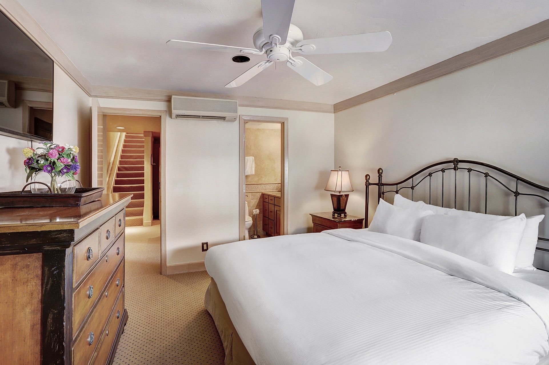 A queen bed with ensuite from the 4 bedroom penthouse suite at The Hythe Vail