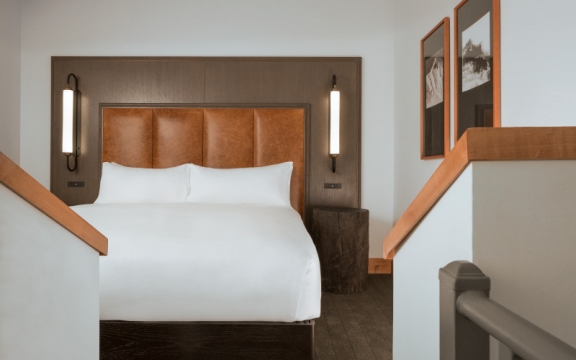 A king bed in a bi-level suite at The Hythe Vail