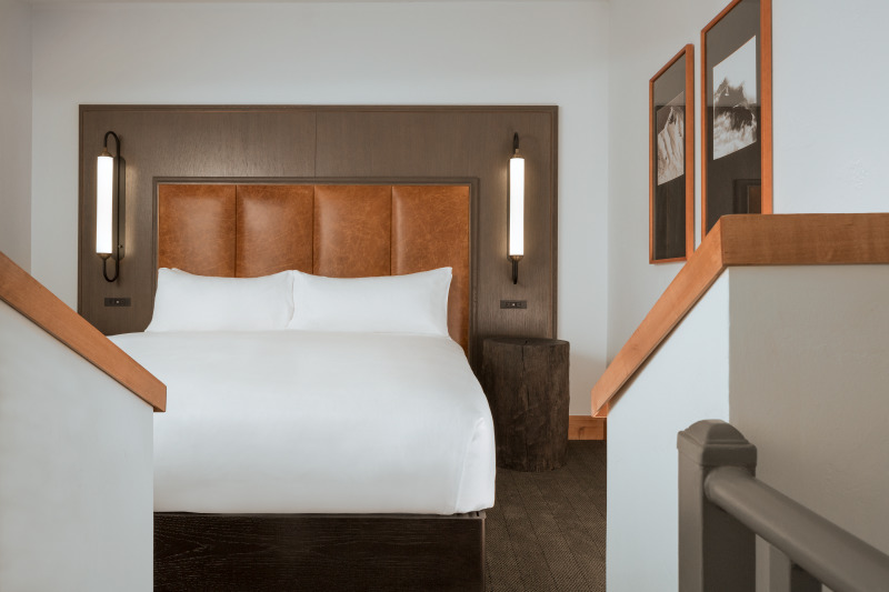A king bed in a bi-level suite at The Hythe Vail