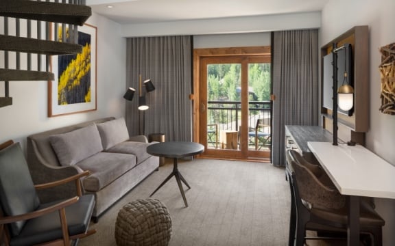 The living room of a bi-level suite at The Hythe Vail