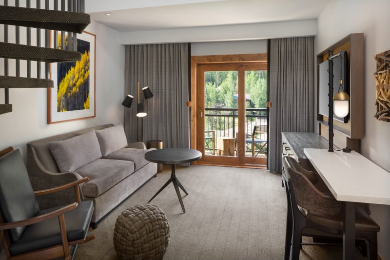 The living room of a bi-level suite at The Hythe Vail