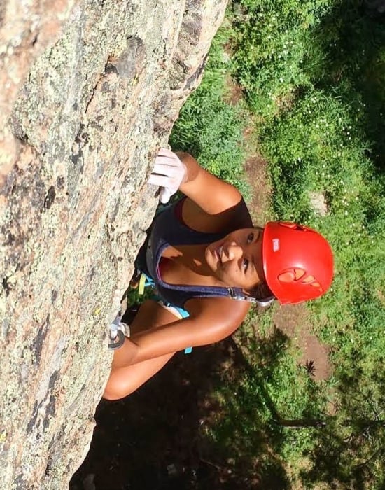 A woman outdoor rock climbing in Vail CO