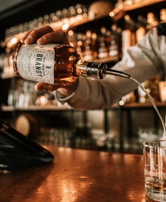 Bartender pouring whiskey