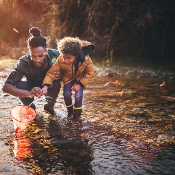 A father and son fishing a stream in Vail CO