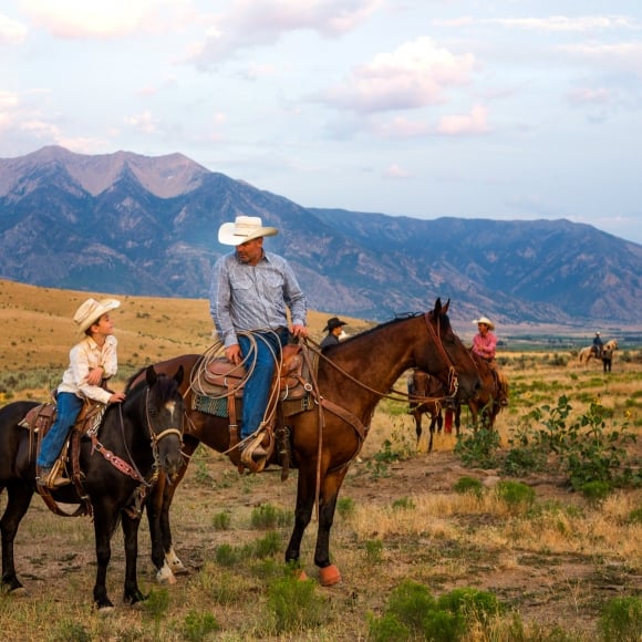 A father and son on horseback in Vail CO