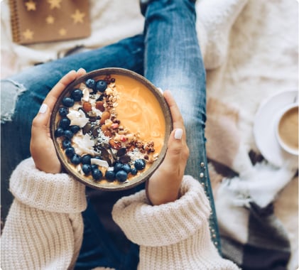 A person holding a hot chocolate
