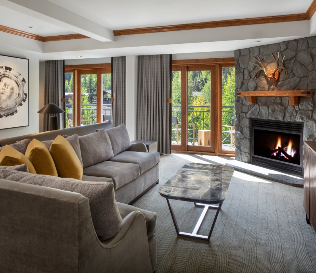 The living area and fireplace from the Timberline Suite at The Hythe Vail