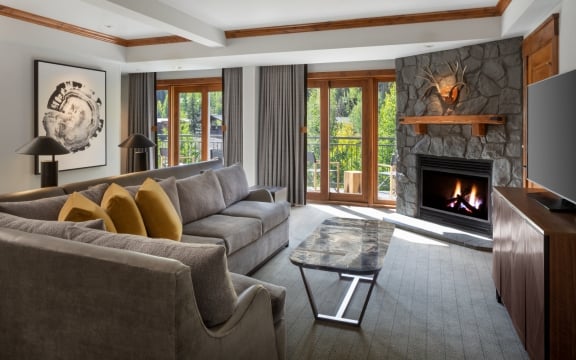 The living area and fireplace from the Timberline Suite at The Hythe Vail