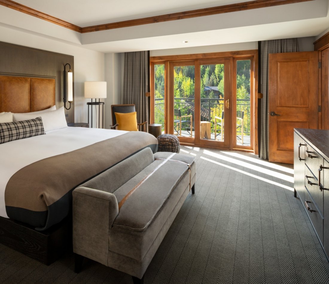 The king bed and main room from the Timberline Suite at The Hythe Vail