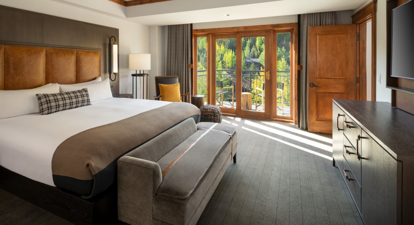 The king bed and main room from the Timberline Suite at The Hythe Vail