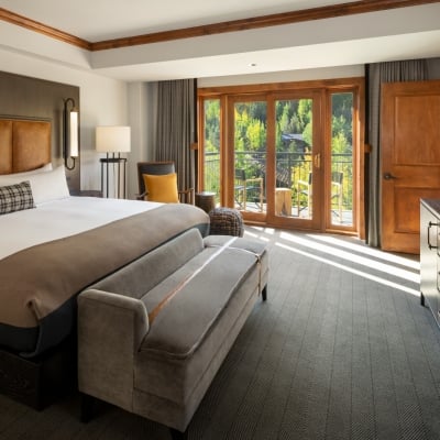 The king bed and main room from the Timberline Suite at The Hythe Vail