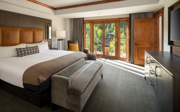 The king bed and main room from the Timberline Suite at The Hythe Vail