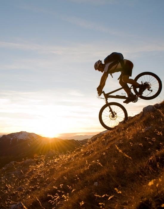 A man downhill mountain biking in Vail CO