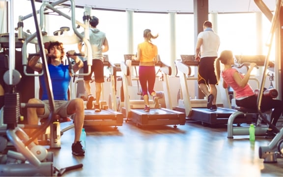 A group of people working out at the fitness center in The Hythe Vail
