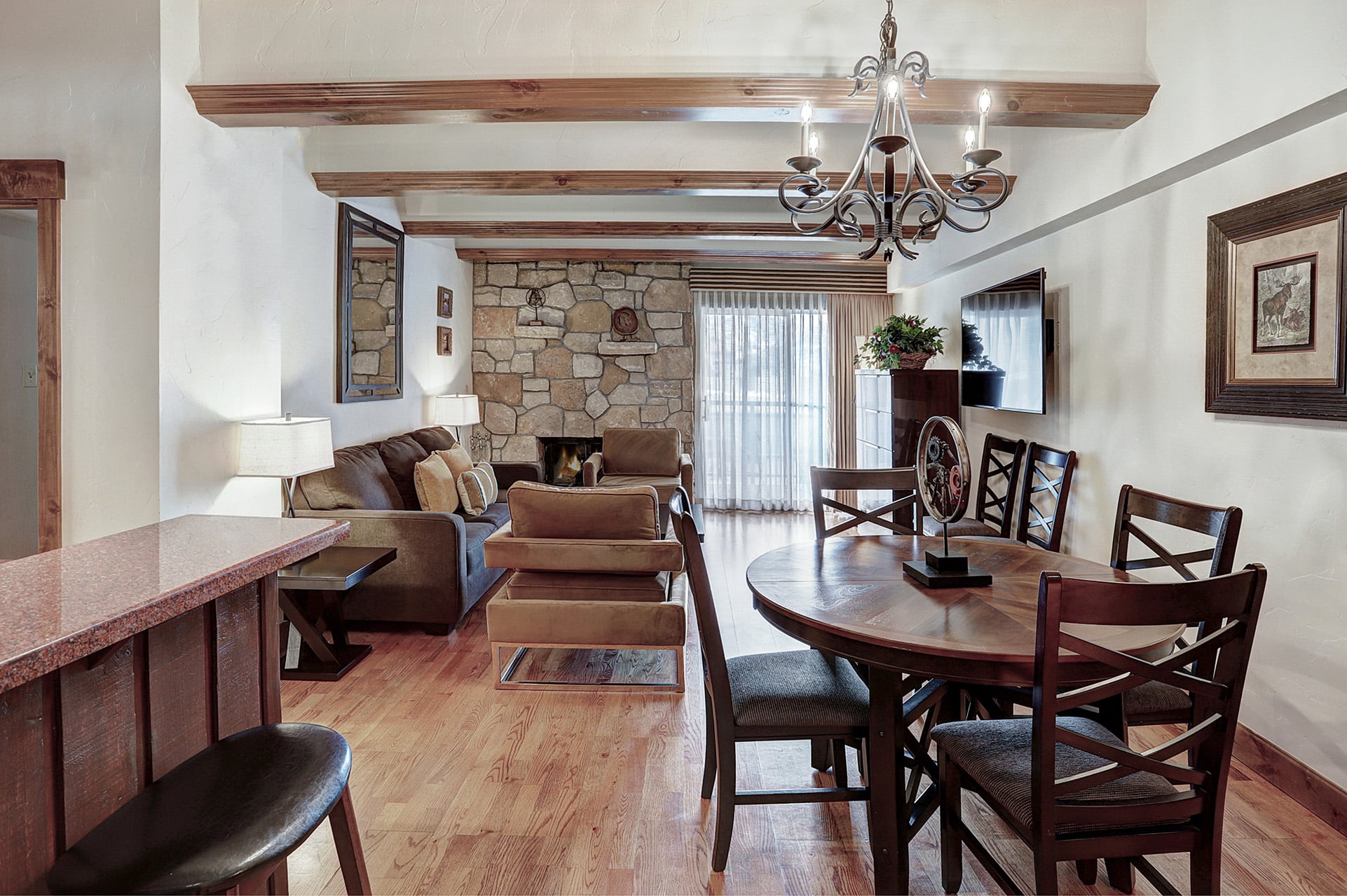 The dining area and lounge of a 2 bedroom suite at The Hythe Vail CO