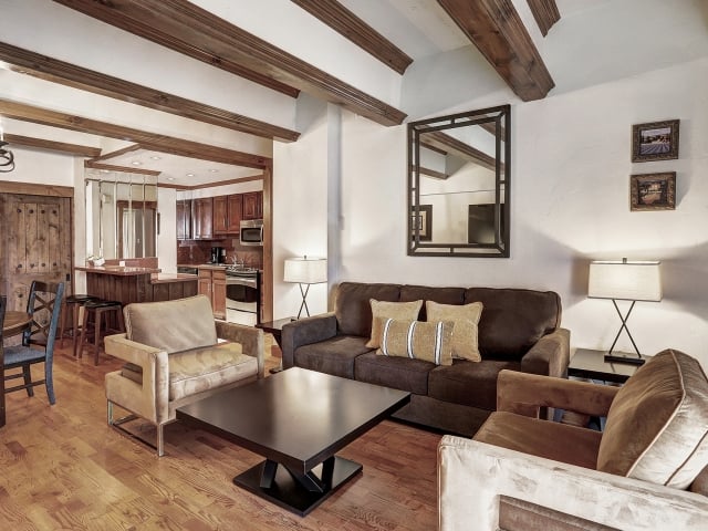 The kitchenette and lounge of a 2 bedroom suite at The Hythe Vail CO