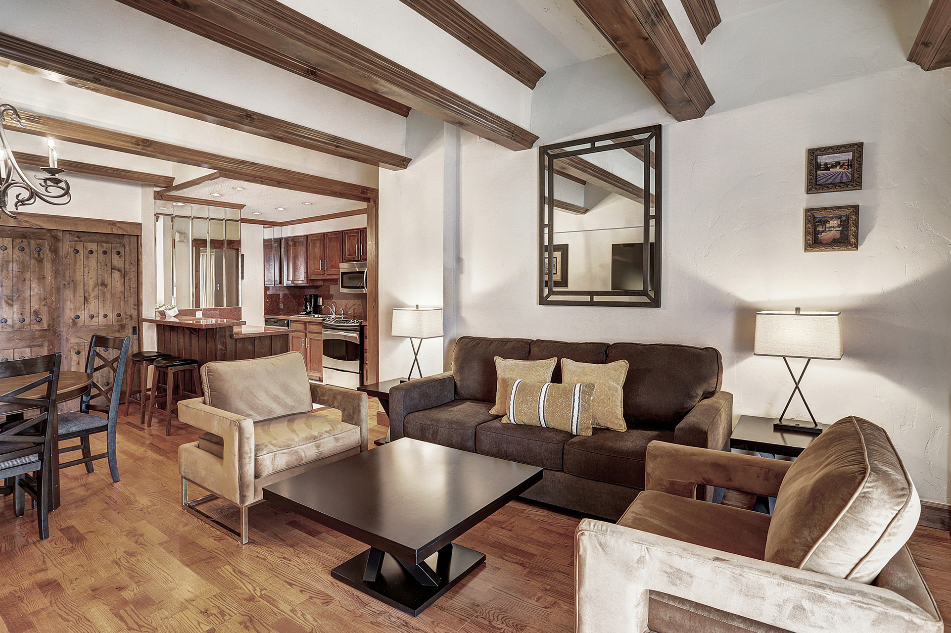 The kitchenette and lounge of a 2 bedroom suite at The Hythe Vail CO