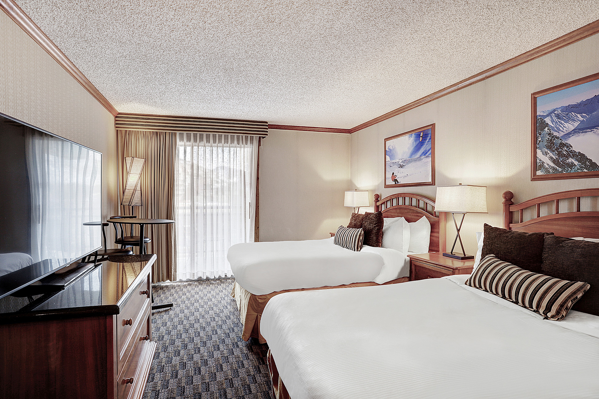 Two double beds from the 2 bedroom suite at The Hythe Vail CO
