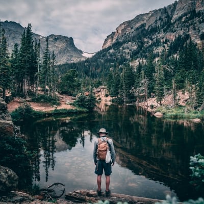 jonathan montalvo overlooking a calm lake in Vail, CO